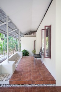 view of the Entry Foyer: The courtyard with plants provided at a lower level from this foyer is also visible.